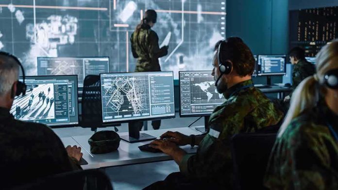 shutterstock_1936992973-2 Military analysts at computers in a command center