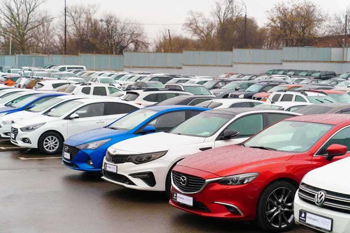 shutterstock_2116171796 Rows of parked cars in a dealership lot