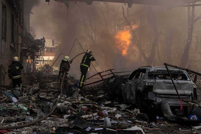 shutterstock_2148294615 Firefighters tackle blaze amid rubble and a burned car
