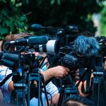 Convicted Idaho Killer Says His Guilty Plea Was Built on “False Promises” TV news cameras crowding together at an outdoor event