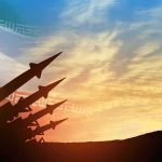 missile silhouettes under Iran flag at sunset