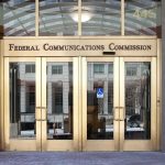 Pride Night Dispute Puts Under Federal Scrutiny Federal Communications Commission building entrance with gold doors