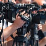The World’s Oil Lifeline Becomes a War of Warnings television cameras on tripods at a media event