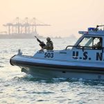 US Anti-Drug Strikes Expand as Critics Demand Proof U.S. Navy patrol boat with armed crew on the water