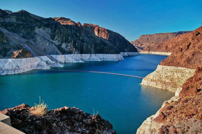 shutterstock_555840826-1 Reservoir between rugged desert cliffs with stark white shoreline