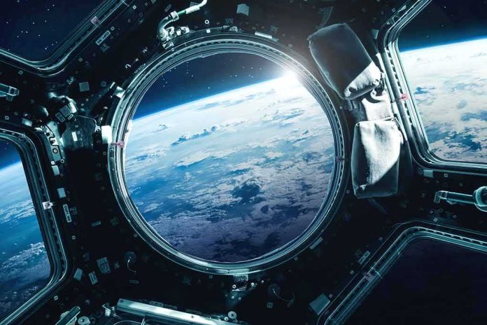 shutterstock_691137475-1 Earth seen through a spacecraft window