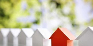 Homeowner Loses $475K Home Over HOA Debt Red paper house among white paper houses