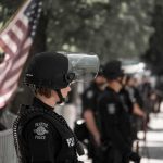 Seattle Pride Video Fuels Dispute Over What Happened police officer in riot gear standing in a line