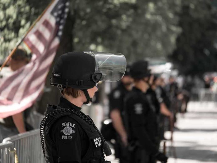 shutterstock_774295192 police officer in riot gear standing in a line