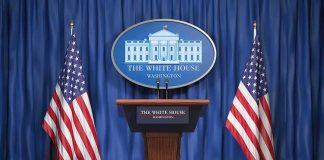 Trump’s Peace Push Raises Ukraine Tensions White House press podium with microphones and two American flags