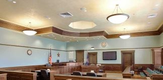 Trump’s Legal Claim on Medical Debt Lawsuits Challenged Empty courtroom with wooden benches and judge's bench