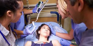 Young Woman Faces Sudden Paralysis Overnight Patient on hospital gurney surrounded by medical staff