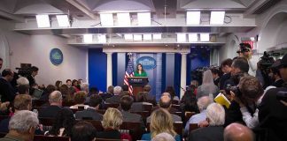 Obama and Trump Clash Over White House Renovations Press secretary at podium addressing reporters in briefing room